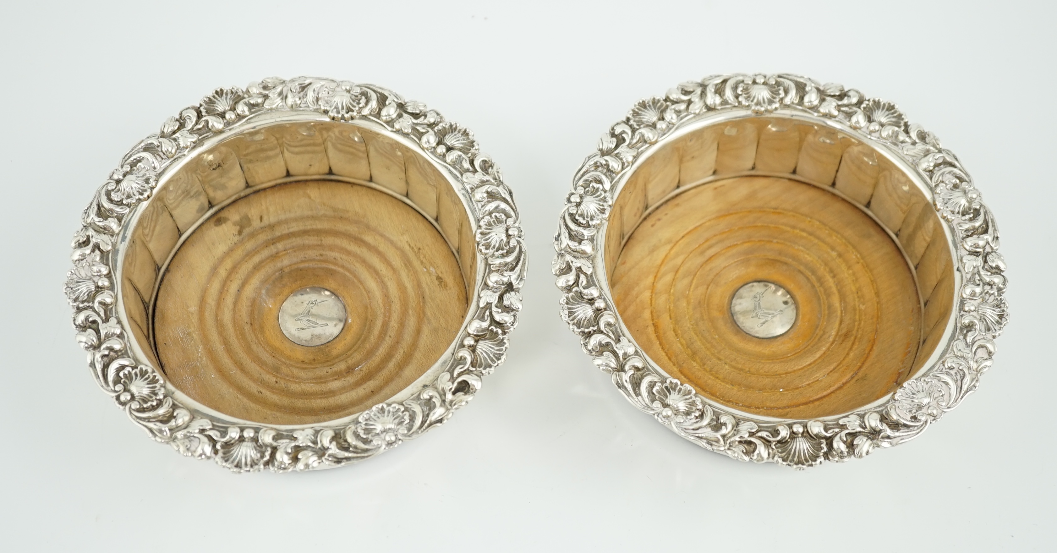 A pair of George III silver mounted wine coasters, by John & Thomas Settle Gunn & Co